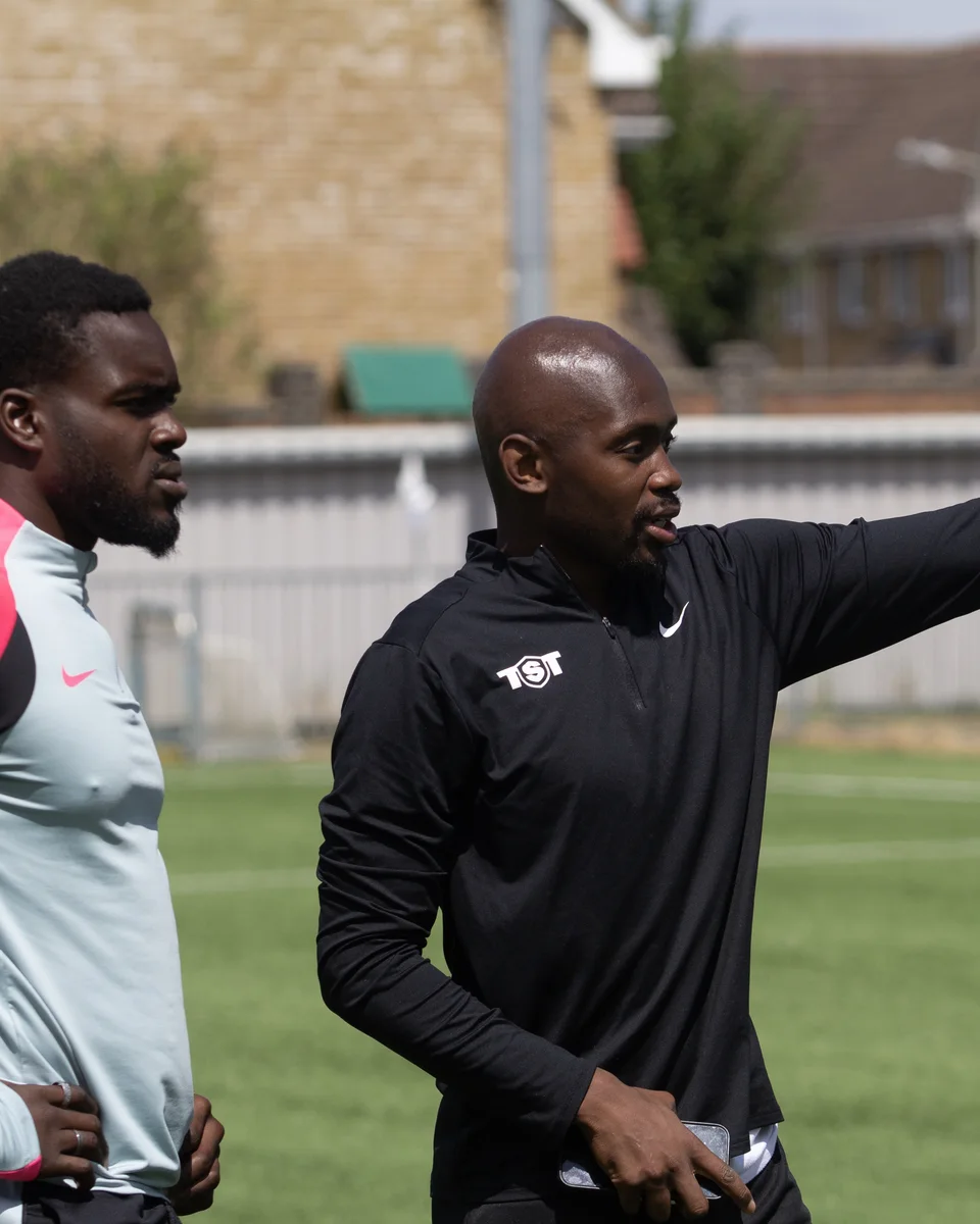 Jordan Antonio Brown coaching a player during a Half a Yard session